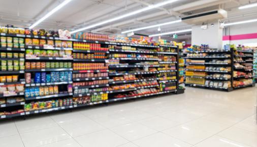 Food on shelves in grocery store aisle