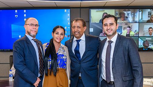 Greivin Arrieta Chacon poses with Regina LaGatta and President Ramsammy