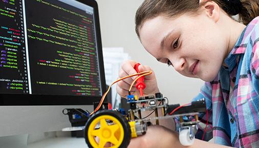 A young girl works on a STEM project